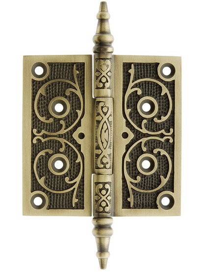 4 inch Cast Iron Steeple Tip Hinge With Decorative Vine Pattern In Antique Brass